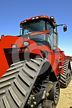 Red tractor with continuous track