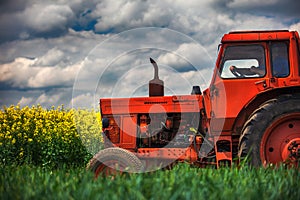 Red tractor in a field