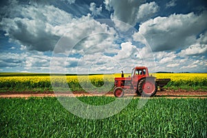 Red tractor in a field