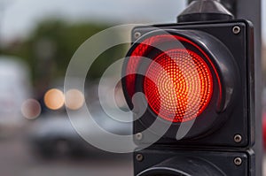 Red traffic light in the city street