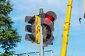 Red traffic light in the city street