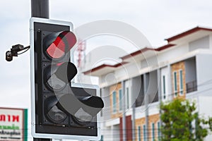 Red traffic light in the city street