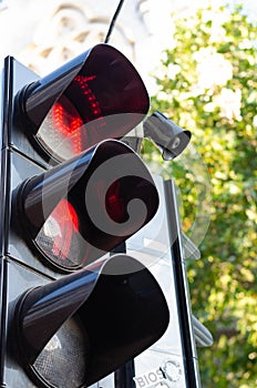 Red traffic light in the city street. Safety concept. Prohibition of passage for pedestrians