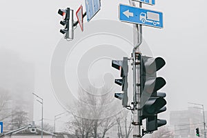 Red traffic light in fog