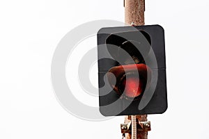 red traffic light regulates the movement on the railway photo