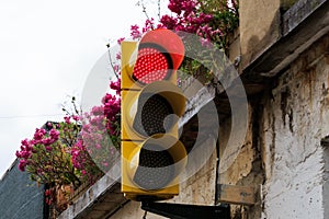 Red traffic light in the streets of Sastago, Spain