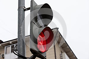 red traffic light with a timer prohibits pedestrians from crossing the road photo