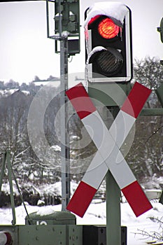 Red traffic lights at the railway crossing