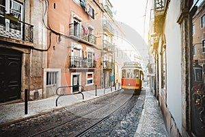Red tram on a narrow European street