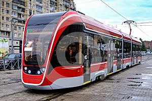 Red tram on the streets of the city