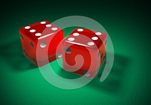 Red transparent dice on green surface