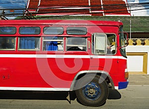 red transportaion public local bus in luang prabang laos photo