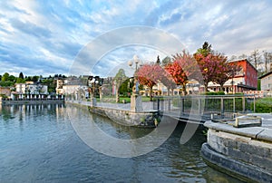 The red trees in embankment in Velden am Worthersee photo