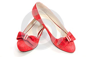 Red trendy pair of ballet flats isolated on white.