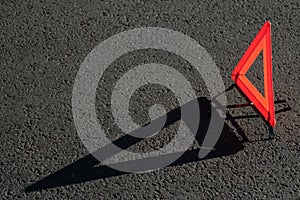 Red triangle of a car on the road