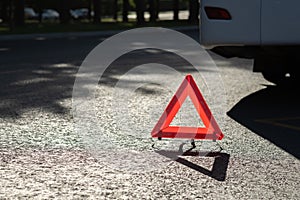 Red triangle of a car on the road