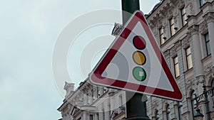 Red triangle posted traffic light sign control city street safety