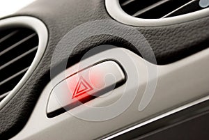 Red triangle warning light in car