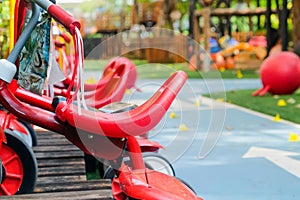 Red tricycle in the park, children\'s playground in the park