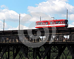 Red Trolley Car On Bridge
