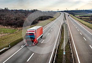 Red truck on a beautiful country highway road