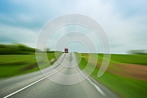 Red truck on blurry background