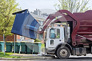 Red truck with a loading household container home maintenance public services