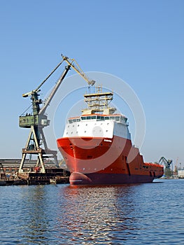 Red tug in shipyard