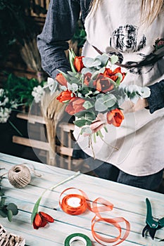 Red tulip in brides flower bouquet