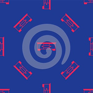 Red TV table stand icon isolated seamless pattern on blue background. Vector
