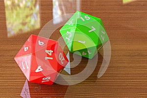 Red twenty-sided die, 20 sides on the wooden table. 3D rendering