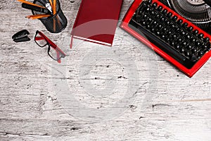 Red typewriter on the table with the office.