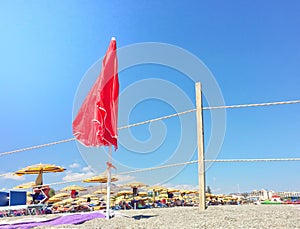 Red umbrella on the beach