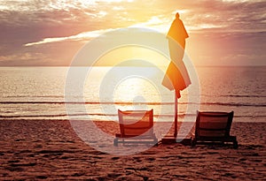 Red Umbrella on the beach in sunrise