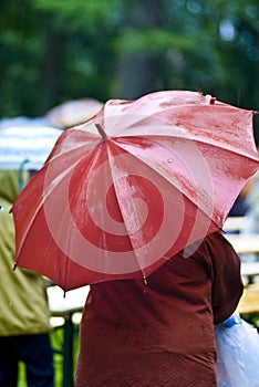 Red umbrella on rainy day