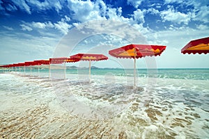 Red umbrellas on beach