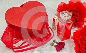 Red underwear knickers in gliter red box heart shaped and perfume lingerie lipstick jewellery photo