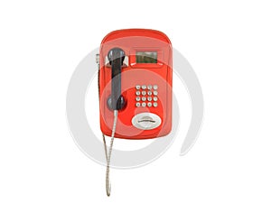 Red urban payphone. Isolated on white background. Close-up.