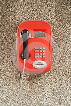 Red urban payphone in the street of Saint-Petersburg