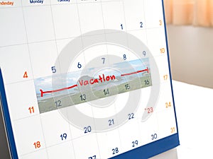 Red vacation write on white calendar marked for remember and tar