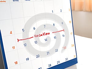 Red vacation write on white calendar marked for remember and target time to long vacation and relax time