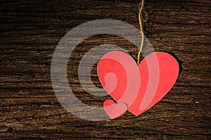 Red Valentine heart on old rustic wooden background. Valentine's