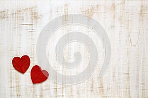Red Valentine`s Day hearts on wooden background