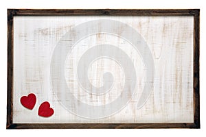 Red Valentine`s Day hearts on wooden frame background