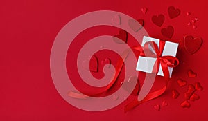 Red Valentines day background. Gift box and mixed hearts top view. Flat lay