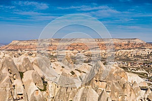 Red Valley and Rose Valley under the sunlight in daytime in Cappadocia, Turkey. Rock formations that changes color from rose to