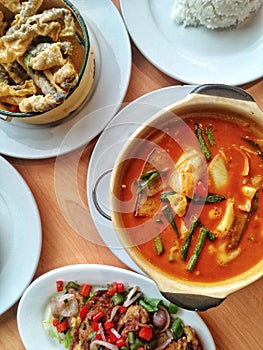 Red vegetable curry, deep-fried soft shell crab and deep-fried fish skin with salted egg yolk