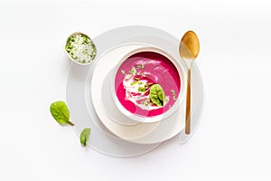 Red vegetarian beet root cream soup with herbal basil salt