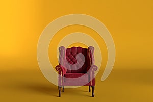 Red velvet armchair of old design on short legs with high back isolated on golden background. 3d rendering illustration