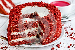 Red velvet cake, classic three layered cake from red butter sponge cakes with cream cheese frosting